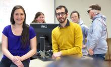 Five members of research team - three behind a monitor, two in front